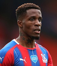 Wilfried Zaha of Crystal Palace looks on during the Premier League match between Crystal Palace and Chelsea FC at Selhurst Park on July 07, 2020 in London, England. Football Stadiums around Europe remain empty due to the Coronavirus Pandemic as Government social distancing laws prohibit fans inside venues resulting in all fixtures being played behind closed doors /Credit:	Pool/Getty Images Europe/2020 Pool