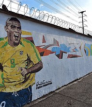 Graffiti depicting Brazilian football star Ronaldo, painted by Brazilian street artist Paulo Consentino in celebration of the FIFA 2014 World Cup./Credit:	Nelson Almeida/afp/getty images