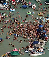 Hundreds of people gathered at Torch Lake, in the northwest corner of the Lower Peninsula in Michigan, over the July 4 weekend./Credit:	Michigan State Police