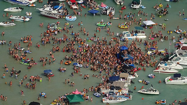 Hundreds of people gathered at Torch Lake, in the northwest corner of the Lower Peninsula in Michigan, over the July 4 weekend./Credit:	Michigan State Police