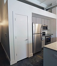A view of a kitchen at CARITAS’ new emergency shelter for women. The complex also will contain the nonprofit’s furniture bank that helps about 800 low-income families annually furnish their homes.