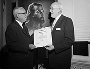 The Rev. J. Manning Potts of Nashville, Tenn., left, presents the 1957 Upper Room Award for World Christian Fellowship to artist Warner Sallman of Chicago at a dinner meeting of church and government offficials on Oct. 3, 1957, at the National Press Club in Washington, D.C. Mr. Sallman was honored for his “Head of Christ” painting shown in the background.