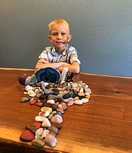 Bridger Walker, 6, saved his sister from a dog attack, he was praised by Anne Hathaway on social media for his deed./Credit:	Courtesy Robert J. Walker