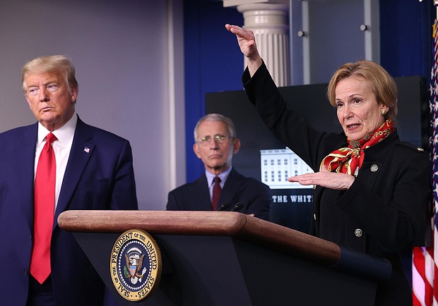 Dr. Birx speaks while flanked by President Donald Trump and Dr. Anthony Fauci during the daily coronavirus task force briefing at the White House on March 31, 2020 in Washington, DC./Credit: Win McNamee/Getty Images