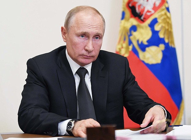 Russia's attempts to influence British politics went unchecked, a new report says. The image shows Russian President Vladimir Putin in a meeting at the Novo-Ogaryovo state residence outside Moscow on May 18, 2020./Credit: ALEXEY NIKOLSKY/Sputnik/AFP/Getty Images
