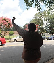 Sonya Beaver, 50, left, waves with her mother, Helen Beaver, 78, as a U.S. Census parade passes by on Clarkson Road in South Side on Saturday. The parade, featuring cars and motorcycles from the Victory 7 Mustang Club and the Buffalo Soldiers Motorcycle Club, was to encourage city residents to complete and return their census forms.