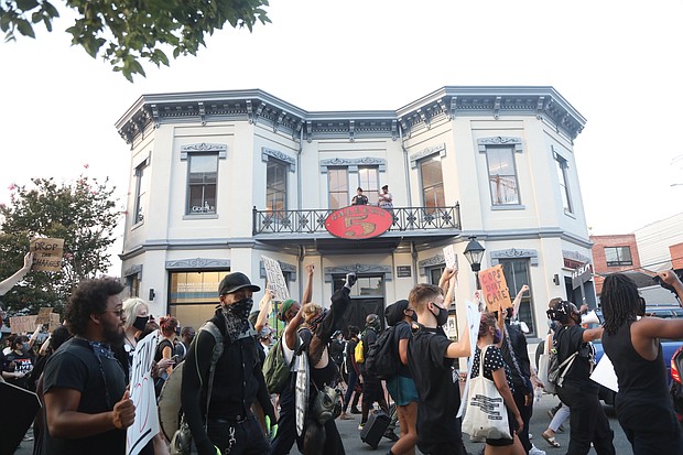 Demonstrators parade past the historic Jackson Ward police-fire station on July 15 on their way to “Reclamation Revival Day 3.” Location: 200 W. Marshall St. They marched to the Richmond Coliseum for a sit-in and speeches before marching and demonstrating about 10:15 p.m. outside the West Clay Street home of City Councilwoman Kim B. Gray.