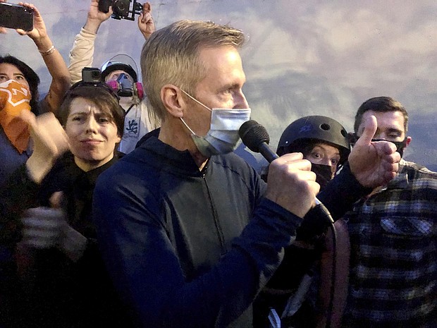 Mayor Ted Wheeler was tear gassed in downtown Portland early Thursday morning, according to video and posts on Twitter from a New York Times journalist. The image shows Wheeler speaking to people gathered in downtown Portland, Ore., Wednesday, July 22, 2020.
