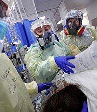 The US recorded more than 915,000 new cases of coronavirus in the past 2 weeks-- that's more than the cases reported across the country for the whole month of June. The image shows nurses treating a Covid-19 patient on July 20, 2020 at Doctors Hospital at Renaissance in Edinburg, Texas./Credit:	Carolyn Cole/Los Angeles Times/Getty Images