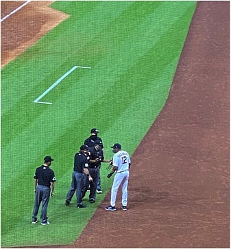 Astros manager Dusty Baker talks with the umpires after the benches were cleared