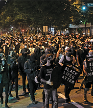 About 1,000 protesters marched through Richmond to show solidarity with demonstrators in Portland, Ore., where federal officers are using questionable force with those they detain or arrest.