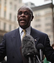 Herman Cain is pictured outside Trump Tower on October 3, 2011, in New York City. The former Republican presidential candidate has died from coronavirus./Credit:	Spencer Platt/Getty Images