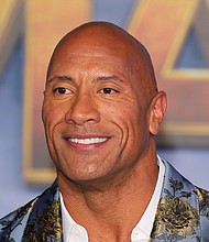 Actor Dwayne Johnson, pictured here in Hollywood on December 9, 2019, said the Netflix film 'Red Notice' will resume filming in a quarantine bubble./Credit:	JEAN-BAPTISTE LACROIX/AFP/AFP via Getty Images