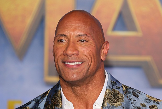 Actor Dwayne Johnson, pictured here in Hollywood on December 9, 2019, said the Netflix film 'Red Notice' will resume filming in a quarantine bubble./Credit:	JEAN-BAPTISTE LACROIX/AFP/AFP via Getty Images