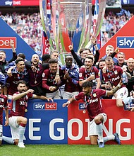 Aston Villa players celebrate victory following the Sky Bet Championship Play-off Final match between Aston Villa and Derby County at Wembley Stadium on May 27, 2019 in London, United Kingdom.
Credit:	Catherine Ivill/Getty Images Europe