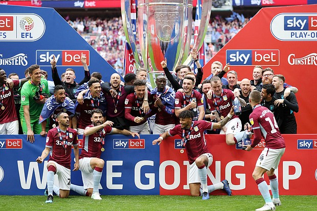 Aston Villa players celebrate victory following the Sky Bet Championship Play-off Final match between Aston Villa and Derby County at Wembley Stadium on May 27, 2019 in London, United Kingdom.
Credit:	Catherine Ivill/Getty Images Europe