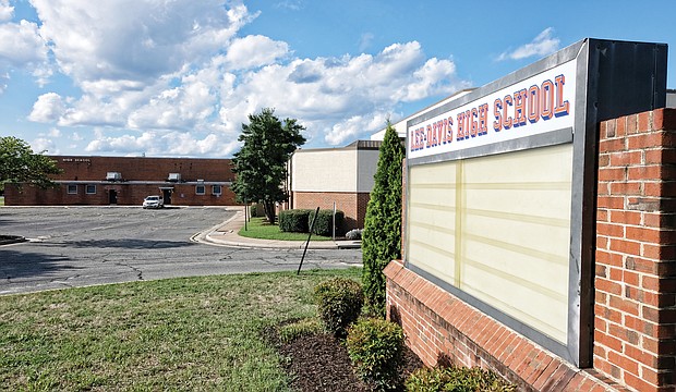 Hanover Branch NAACP officials claim the county school Board bowed to pressure from the Hanover County Board of supervisors to re-install signs bearing the Confederate school names. this one, outside the high school, went back up on the marquee just days ago.