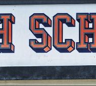A small sign bearing the Confederate battle flag and the words “I Support Confederate Heritage” is posted on the Hanover high school’s marquee.
