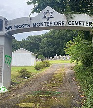 The entrance to Sir Moses Montefiore Cemetery, a Jewish cemetery started by immigrants in 1886 in Fulton, also bears graffiti linked to hate groups.