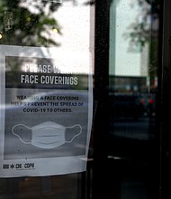 The new Illinois statute comes as disputes over mask use increase. A New Jersey woman attacked another customer at a shop after she asked her to cover her face with a mask./Credit:	Olivia Obineme/Bloomberg via Getty Images