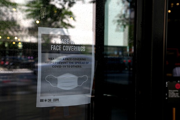 The new Illinois statute comes as disputes over mask use increase. A New Jersey woman attacked another customer at a shop after she asked her to cover her face with a mask./Credit:	Olivia Obineme/Bloomberg via Getty Images