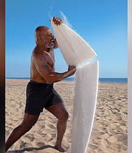 Discovery's "Shark Week" returned Sunday, with a huge shark breach and Mike Tyson cage-diving with sharks./Credit:	Discovery Channel