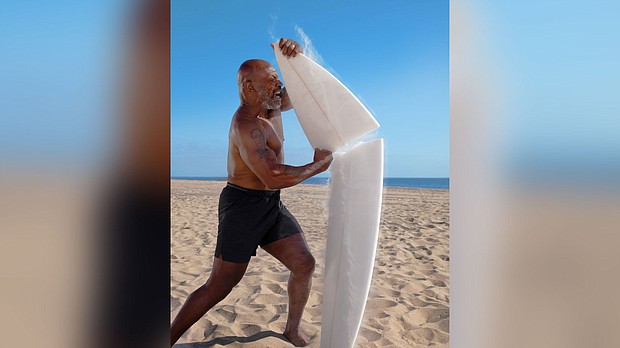 Discovery's "Shark Week" returned Sunday, with a huge shark breach and Mike Tyson cage-diving with sharks./Credit:	Discovery Channel