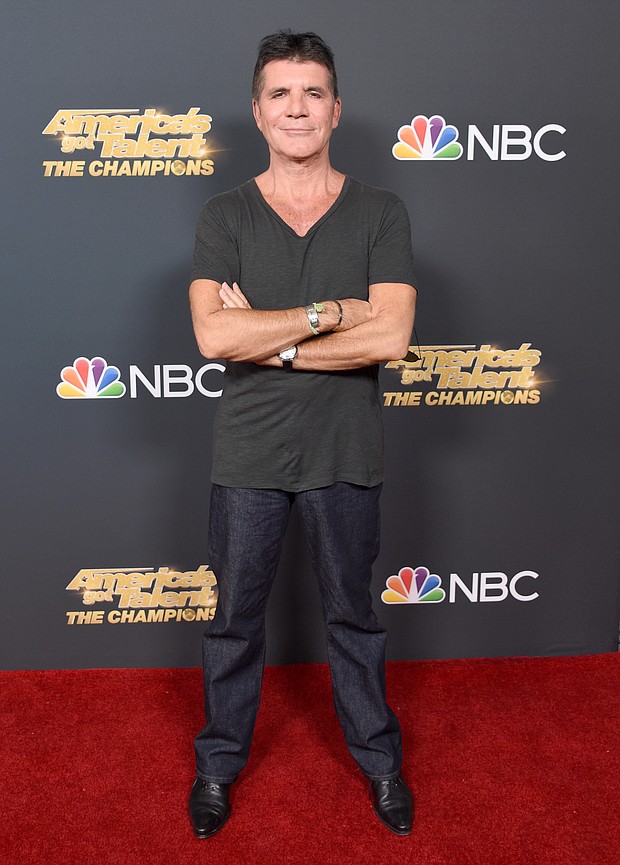 Caption:	Simon Cowell, seen here at the premiere for "America's Got Talent: The Champions," wishes he had read the manual for his new electric bike./Credit:	Gregg DeGuire/Getty Images North America