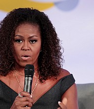 Michelle Obama recently revealed that because of the pandemic and racial injustice in the US, she has been experiencing low-grade depression. The former First Lady is pictured here speaking to guests at the Obama Foundation Summit in Chicago on October 29, 2019./Credit:	Scott Olson/Getty Images