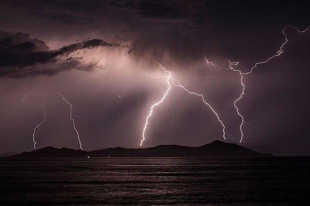 Lightning strikes over the Greek Island of Pserimos on June 03, 2015 in Kos, Greece. Migrants are continuing to arrive on the Greek Island of Kos from Turkey who's shoreline lies approximately 5 Km away. Around 30,000 migrants have entered Greece so far in 2015, with the country calling for more help from its European Union counterparts./Credit:	Dan Kitwood/Getty Images