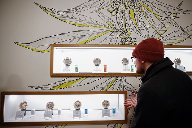 A customer shops for a recreational marijuana at Dispensary 33 store on January 1, 2020, in Chicago, Illinois./Credit:	Kamil Krzaczynski/AFP/Getty Images