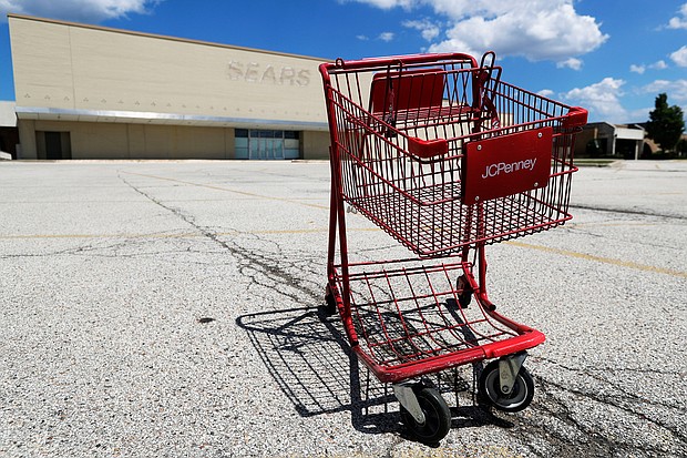 A broken JCPenney shopping cart is seen in an empty parking lot in Niles, Ill., Thursday, June 25, 2020. JCPenney is closing another 13 stores. The department store chain, which filed for bankruptcy last month, is inching toward its target of closing 250 stores about 30% of its network of 846 locations./Credit:	Nam Y. Huh/AP