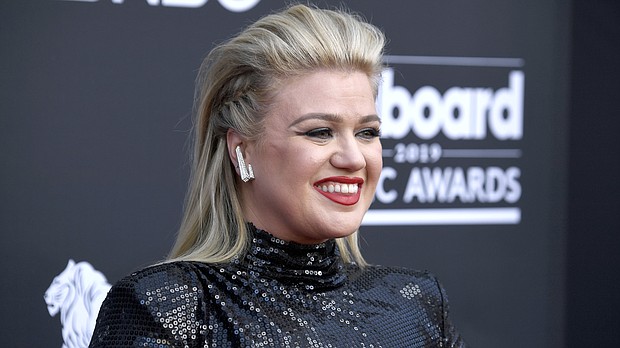 Kelly Clarkson, seen here at the 2019 Billboard Music Awards in 2019, is filling in for judge Simon Cowell this week on "America's Got Talent."/Credit:	Frazer Harrison/Getty Images