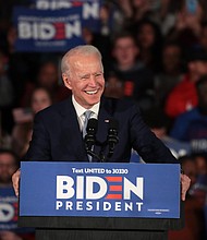 Democratic presidential candidate former Vice President Joe Biden celebrates with his supporters after declaring victory at an election-night rally at the University of South Carolina Volleyball Center on February 29, 2020 in Columbia, South Carolina./Credit:	Scott Olson/Getty Images