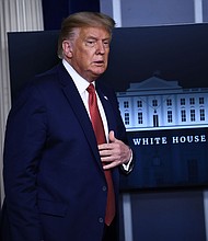 US President Donald Trump arrives to speak to the press in the Brady Briefing Room of the White House in Washington, DC, on August 10, 2020. (Photo by Brendan Smialowski / AFP) (Photo by BRENDAN SMIALOWSKI/AFP via Getty Images)/Credit:	Brendan Smialowski/AFP/Getty Images