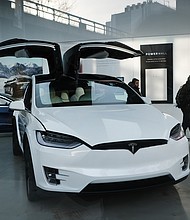 Apple and Tesla, arguably two of the market's most popular companies, both announced stock splits in recent weeks. Are these maneuvers good or bad for investors?/Credit:	Spencer Platt/Getty Images