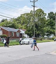 Clean up the community and give away school supplies. Those were the benefits volunteers with the Richmond-based 381 Movement brought Saturday to the Whitcomb Court neighborhood in the East End. Above, movement members pick up litter in the Eastview neighborhood adjacent to the public housing community during the cleanup effort.