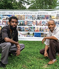 Artists Jeromyah Jones, left, and his father, Jerome W. Jones Jr., display their “I AM 400” banner outside at Pine Camp Cultural Arts and Community Center. It shows many seminal events and people in African-American history during the last 400 years.