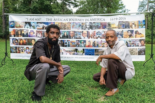 Artists Jeromyah Jones, left, and his father, Jerome W. Jones Jr., display their “I AM 400” banner outside at Pine Camp Cultural Arts and Community Center. It shows many seminal events and people in African-American history during the last 400 years.