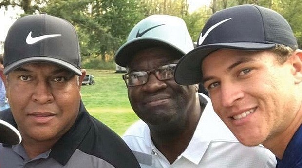 Golfer Cameron Champ, right, with his dad, Jeff Champ, left, and his late grandfather, Mack Champ.