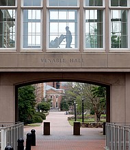 A delivery is made on an otherwise deserted campus at the University of North Carolina in Chapel Hill, N.C., on March 18, 2020./Credit:	Gerry Broome/AP