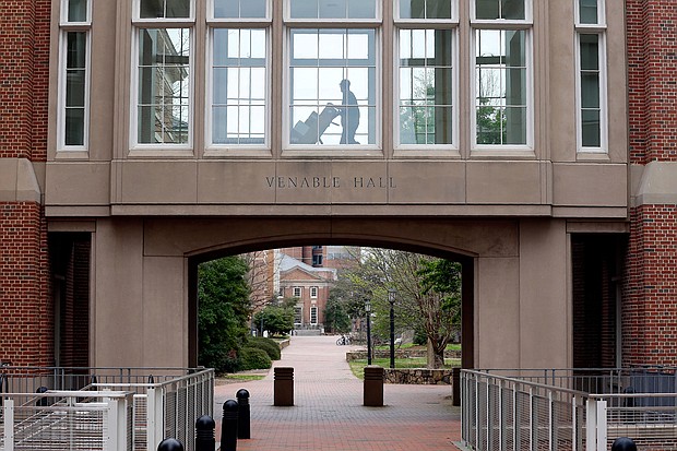 A delivery is made on an otherwise deserted campus at the University of North Carolina in Chapel Hill, N.C., on March 18, 2020./Credit:	Gerry Broome/AP
