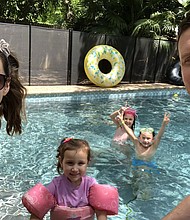 Employees at GitLab are encourage to post photos of what they did on their day off. Employee Eric Brinkman spent time in the pool with his family./Credit:	Courtesy Eric Brinkman