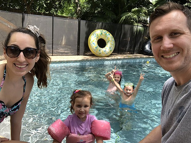 Employees at GitLab are encourage to post photos of what they did on their day off. Employee Eric Brinkman spent time in the pool with his family./Credit:	Courtesy Eric Brinkman