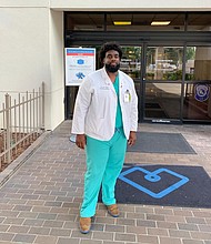 Russell Ledet, a medical student at Tulane University, stands outside Baton Rouge General Medical Center. Ledet formerly worked as a security guard at the hospital./Credit:	Russell Ledet
