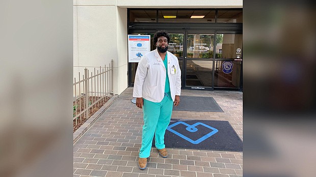 Russell Ledet, a medical student at Tulane University, stands outside Baton Rouge General Medical Center. Ledet formerly worked as a security guard at the hospital./Credit:	Russell Ledet