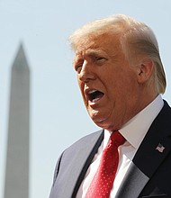 At an event aimed at highlighting the 100th anniversary of women's right to vote, President Donald Trump disparaged the country's most admired woman, Michelle Obama as "over her head" after she delivered a scathing, direct-to-camera speech criticizing him at the Democratic National Convention./Credit:	Chip Somodevilla/Getty Images North America/Getty Images