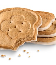The bread-shaped cookies look like miniature slices of French toast topped with icing./Credit:	Girl Scouts of the USA