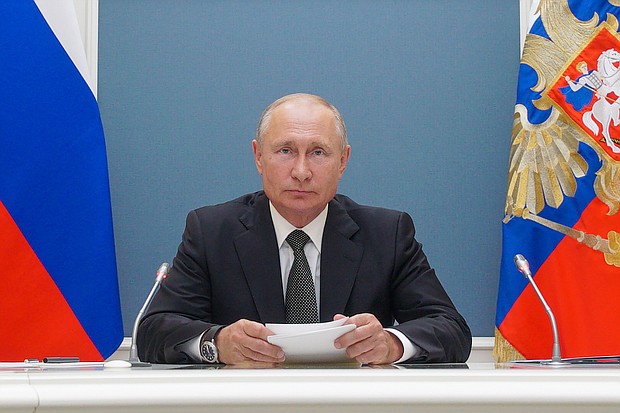 Russia's President Vladimir Putin attends via video link the inauguration ceremonies for new medical centers built by Russia's Defense Ministry in Dagestan, Voronezh Region, and Penza Region./Credit:	Alexei Druzhinin/TASS/Getty Images
