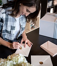 Dana Osborne has had to adjust her invitation card business in response to Postal Service slowdown./Credit: Cara Bresette-Yates